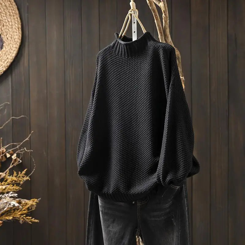 Elisabeth Strickpullover in Schwarz auf dem Bügel
