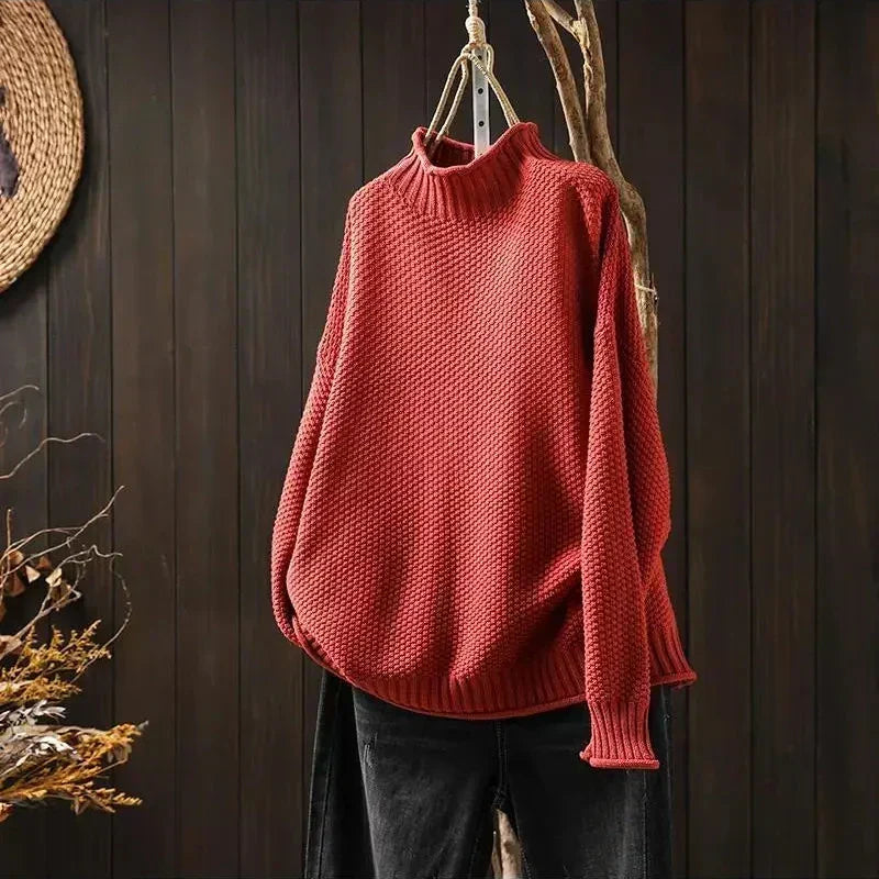 Elisabeth Strickpullover in Rot auf dem Bügel