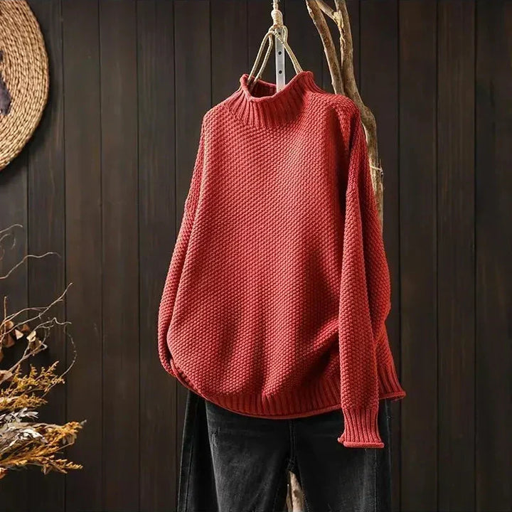 Elisabeth Strickpullover in Rot auf dem Bügel